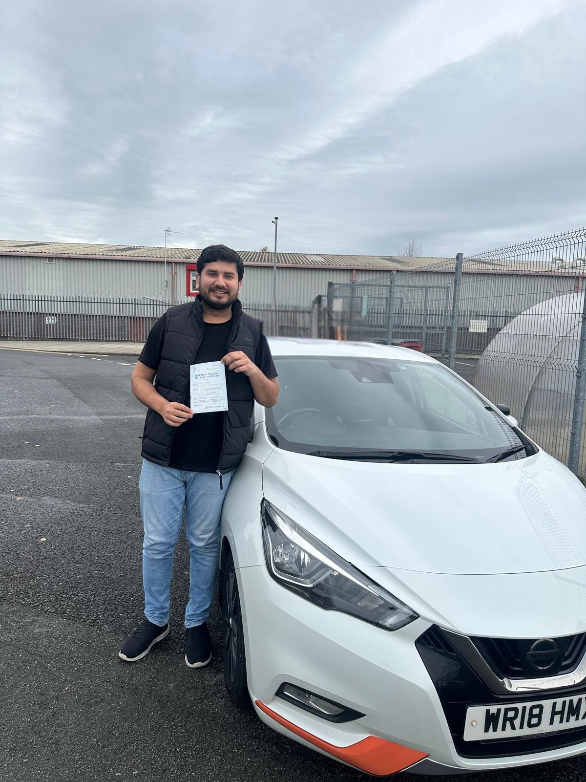 Student celebrating passing driving test in Manchester